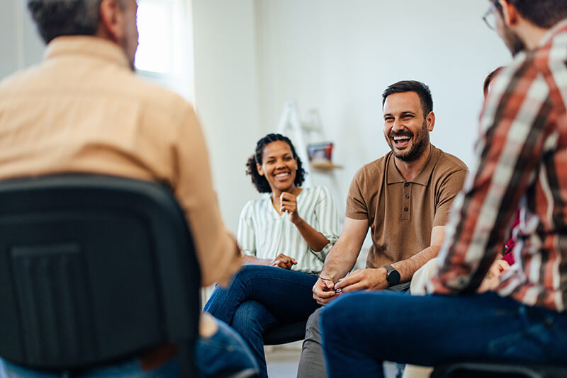 People participate in group therapy as part of a mental health treatment program.