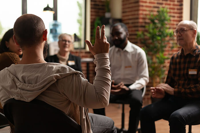 People participate in group therapy at a mental health treatment center.